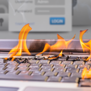 computer keyboard on fire with keys melting